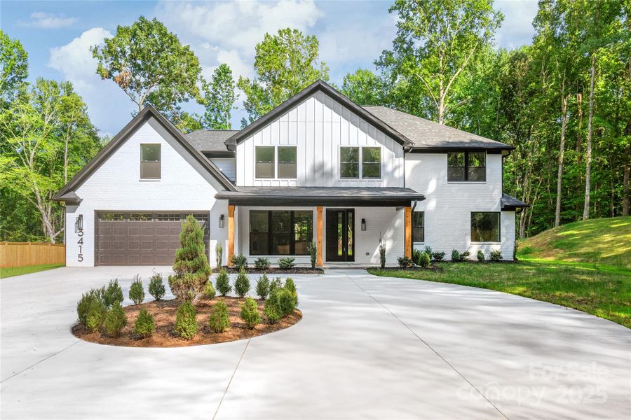 Front exterior of a new home in , Waxhaw, NC, highlighting curb appeal (Image 24). Front exterior of a new home in , Waxhaw, NC, highlighting curb appeal (Image 24).