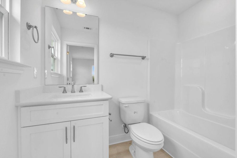 Representative furnished interior of a home built from the 2525 by Adams Homes in Parkland Place, Pace (Image 7).