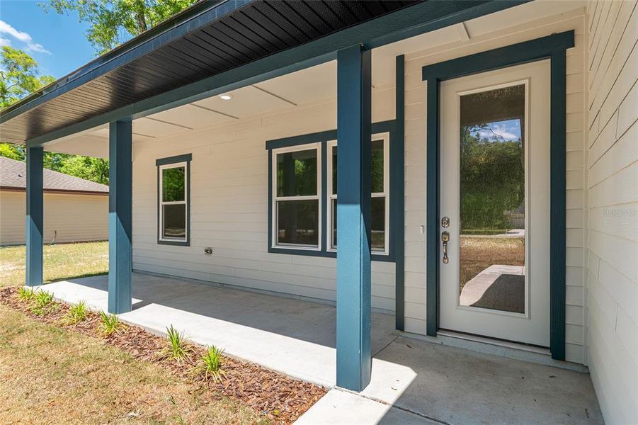Exterior details and patio area of a home in , Fort White (Image 32).