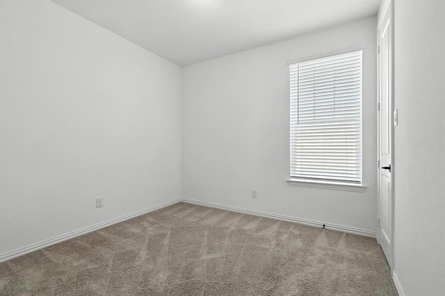Bedroom 2 with large window too.