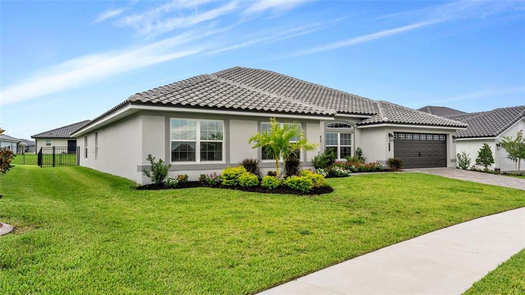 Front exterior of a new home in Lake Juliana Estates, Auburndale, FL, highlighting curb appeal (Image 23).