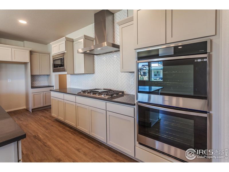 Double Ovens and Gas range with Stainless Steel Hood