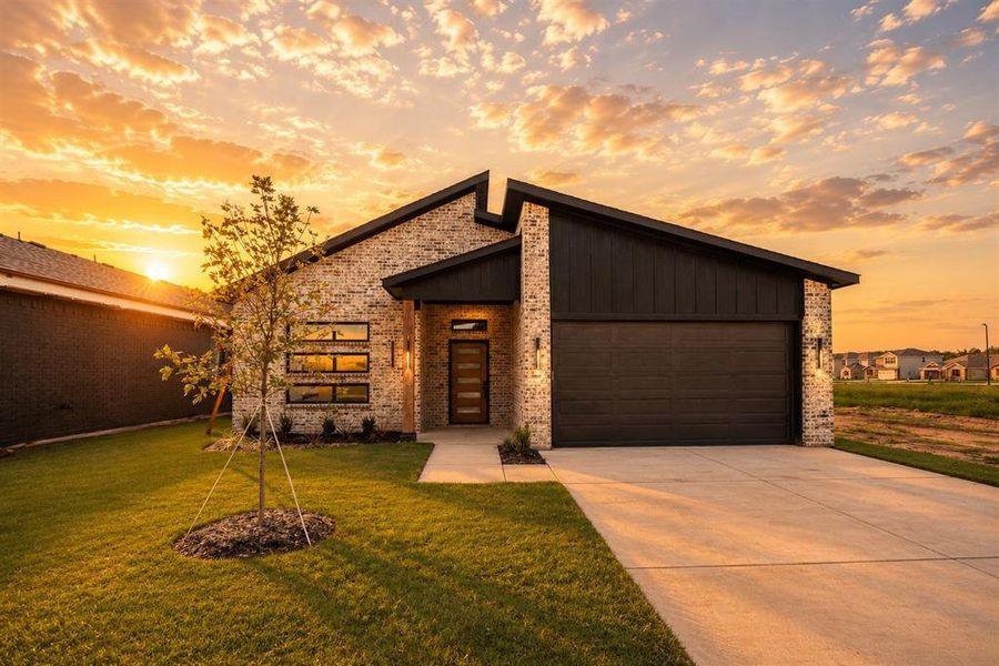 Front exterior of a new home in , Greenville, TX, highlighting curb appeal (Image 18).