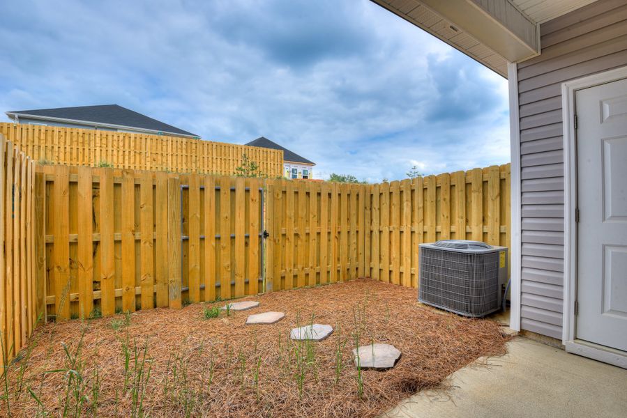 Front exterior of a new home in Windsor Townhomes, North Augusta, SC, highlighting curb appeal (Image 19). Front exterior of a new home in Windsor Townhomes, North Augusta, SC, highlighting curb appeal (Image 19).