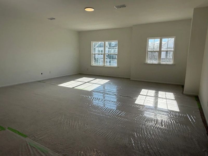 Loft featuring the AW Collection® Coastal - Flexible open space filled with natural light.