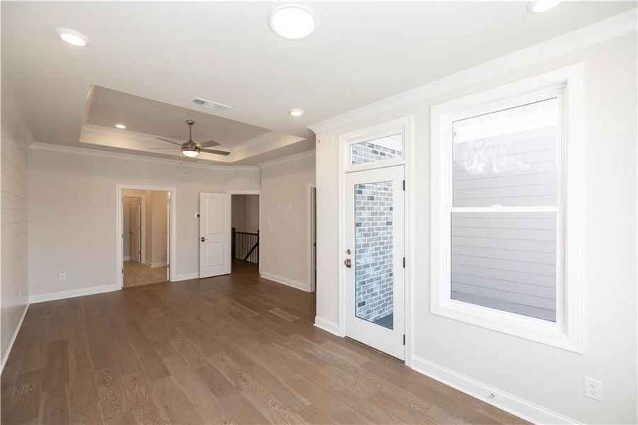 Primary bedroom view from sitting area- private deck and walk in closet. Image is of previously built Chamberlain