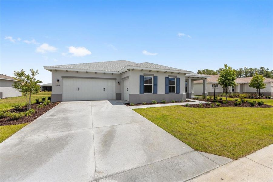 Front exterior of a new home in , Ocala, FL, highlighting curb appeal (Image 20). Front exterior of a new home in , Ocala, FL, highlighting curb appeal (Image 20).