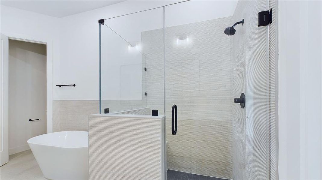 Alternate view of the your glass enclosed shower, and soaking tub.