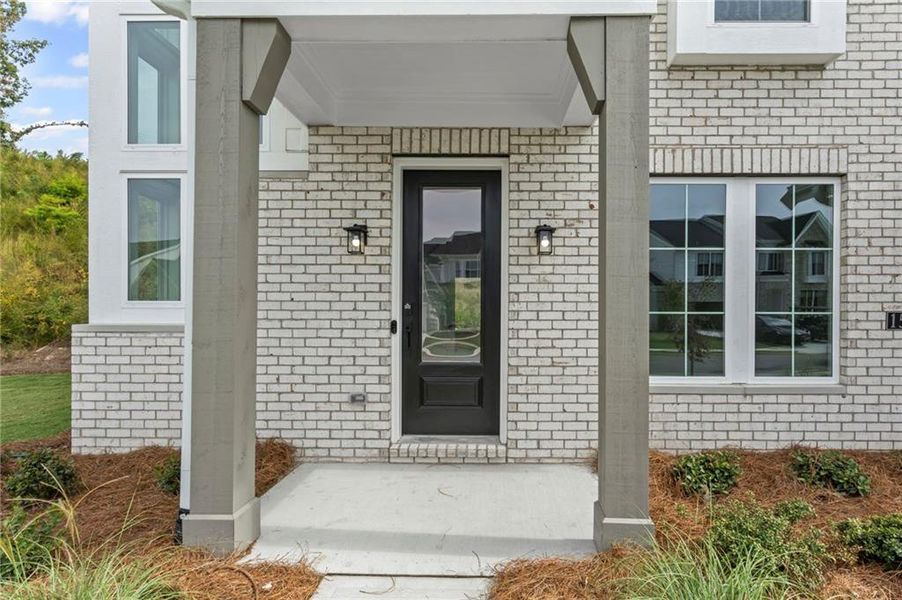 Exterior details and patio area of a home in Twin Lakes, Hoschton (Image 22).