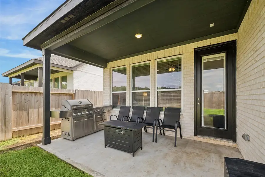 Covered outdoor living area perfect for relaxing or entertaining.