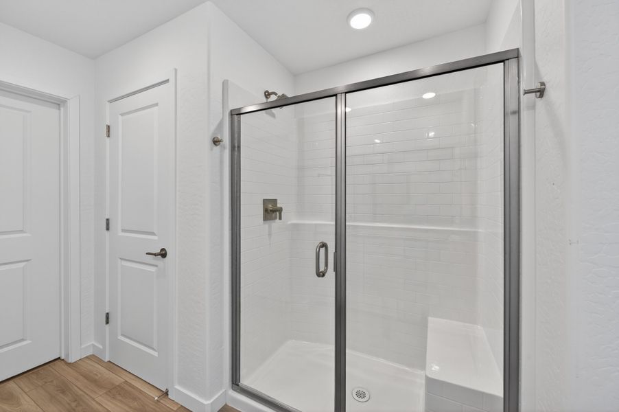 A bathroom with a glass shower. A bathroom with a glass shower.