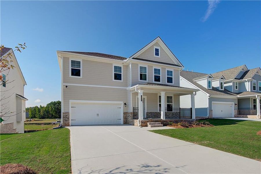 Front exterior of a new home in Cooper Park, McDonough, GA, highlighting curb appeal (Image 2).