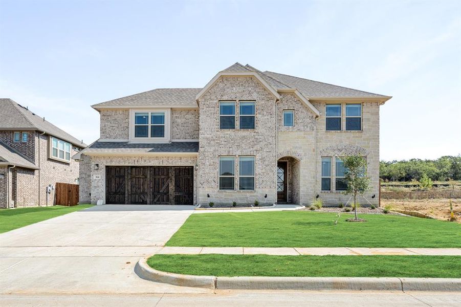 Front exterior of a new home in Parks at Panchasarp Farms 65, Burleson, TX, highlighting curb appeal (Image 2). Front exterior of a new home in Parks at Panchasarp Farms 65, Burleson, TX, highlighting curb appeal (Image 2).