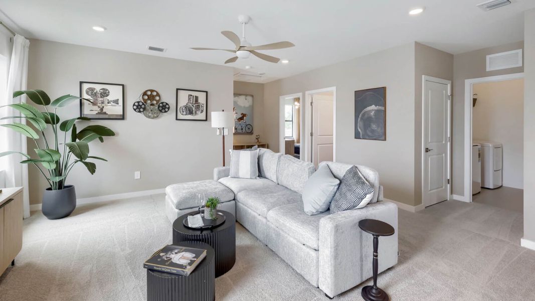 Representative furnished interior of a home built from the Robie by D.R. Horton in Blossom Trail, Greenacres (Image 11).