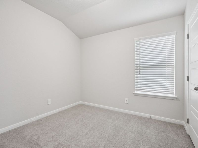Guest bedroom in the Briscoe floorplan at a Meritage Homes community. Guest bedroom in the Briscoe floorplan at a Meritage Homes community.