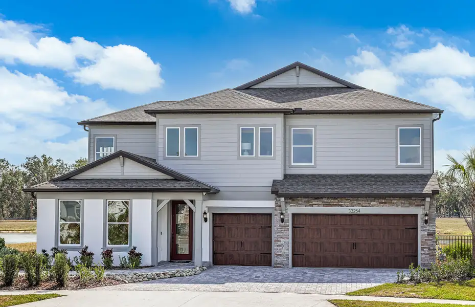 Representative exterior photo of a completed home built from the Merlot Grand by Pulte Homes in Two Rivers, Zephyrhills, FL (Image 19). Representative exterior photo of a completed home built from the Merlot Grand by Pulte Homes in Two Rivers, Zephyrhills, FL (Image 19).