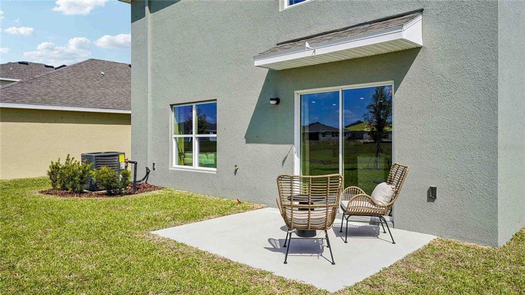 Exterior details and patio area of a home in Emerson Pointe, Ocala (Image 3).