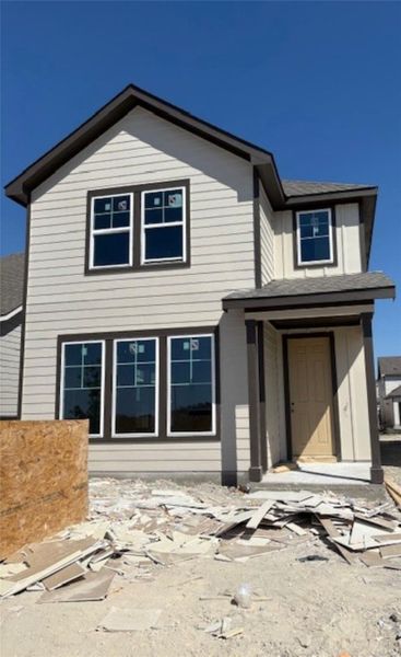 View of front of house with a shingled roof View of front of house with a shingled roof