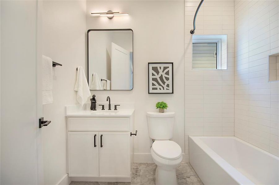 Full bathroom featuring vanity and shower / tub combination Full bathroom featuring vanity and shower / tub combination