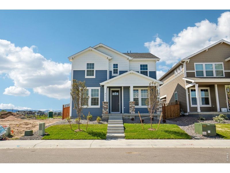 Front exterior of a new home in Timnath Lakes, Timnath, CO, highlighting curb appeal (Image 19). Front exterior of a new home in Timnath Lakes, Timnath, CO, highlighting curb appeal (Image 19).