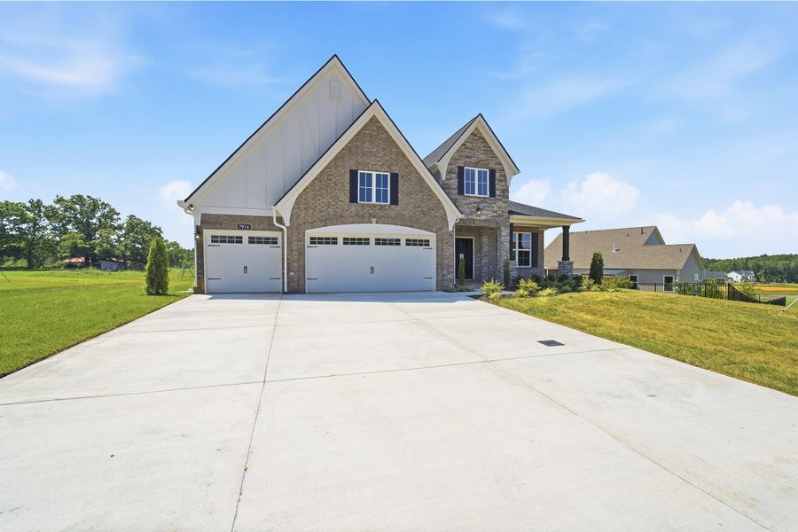 Front exterior of a new home in Aden Woods, Fairview, TN, highlighting curb appeal (Image 23).