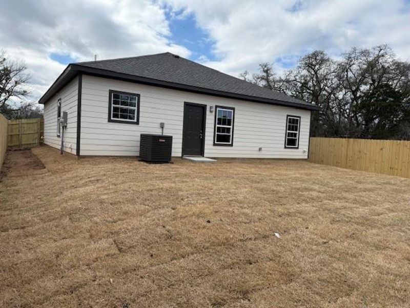 Back of property featuring central AC and roof with shingles Back of property featuring central AC and roof with shingles