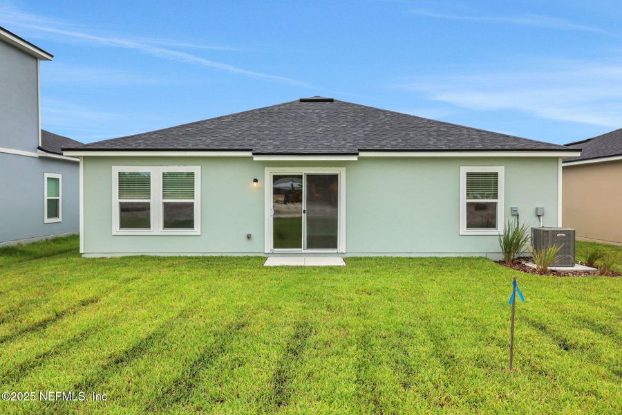 Front exterior of a new home in Bellbrooke, Jacksonville, FL, highlighting curb appeal (Image 5).