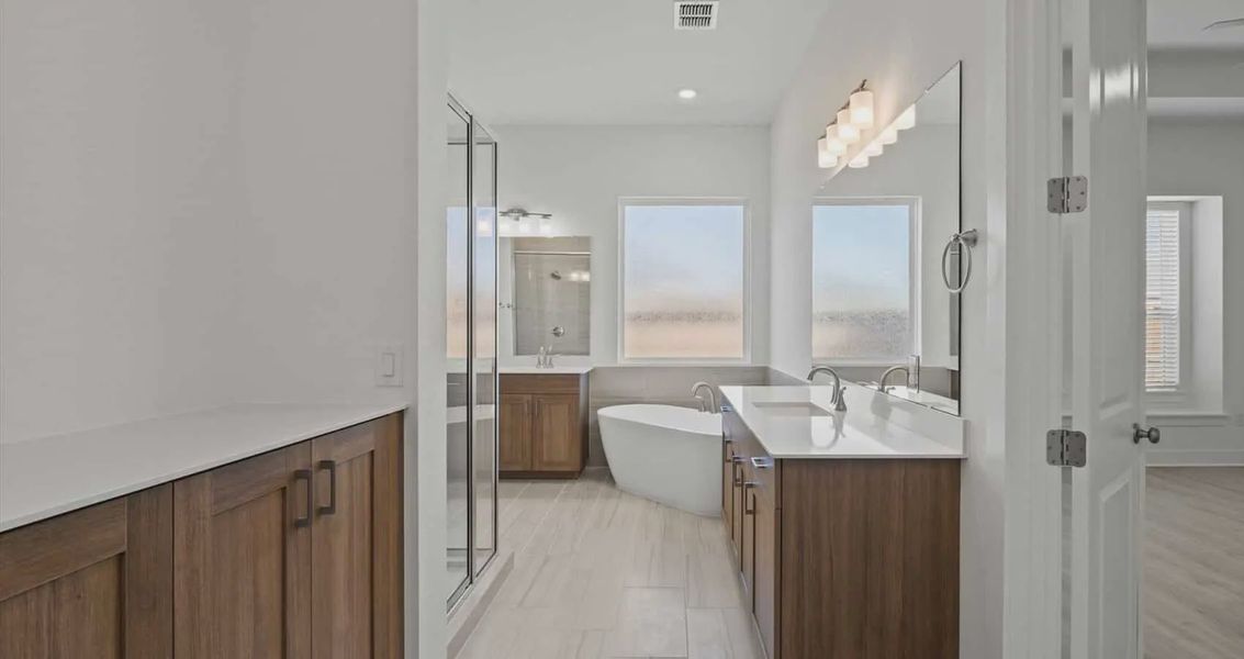 Representative furnished interior of a home built from the Samantha by Chesmar Homes in Village at Three Oaks, Seguin (Image 5).
