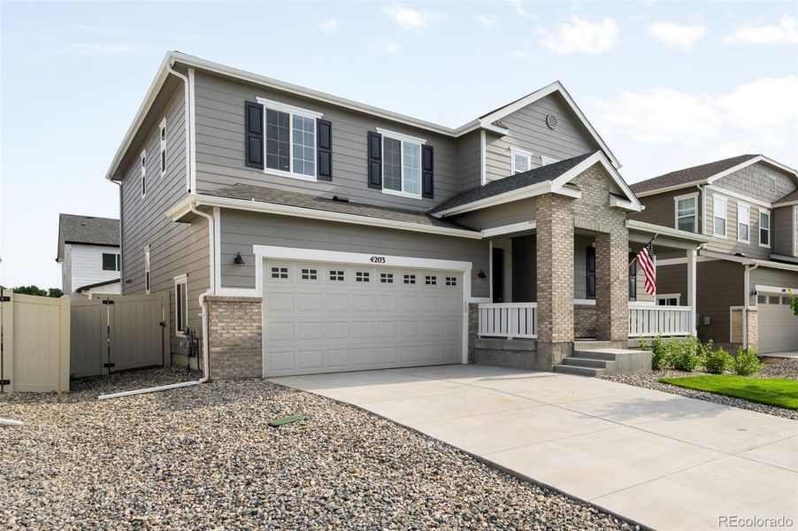 Exterior details and patio area of a home in Thompson River Ranch, Johnstown (Image 21).