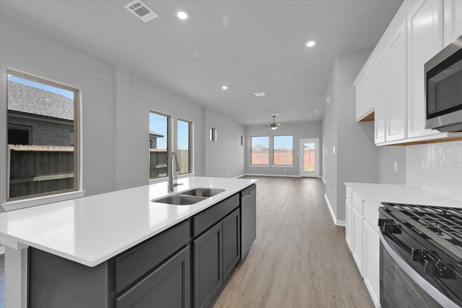Furnished interior view inside a new home in Sunterra 40, Katy (Image 7).