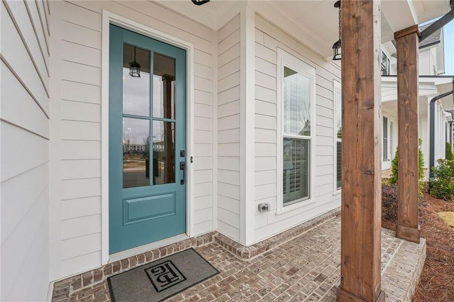 Exterior details and patio area of a home in Promenade at Sawnee Village, Cumming (Image 24).