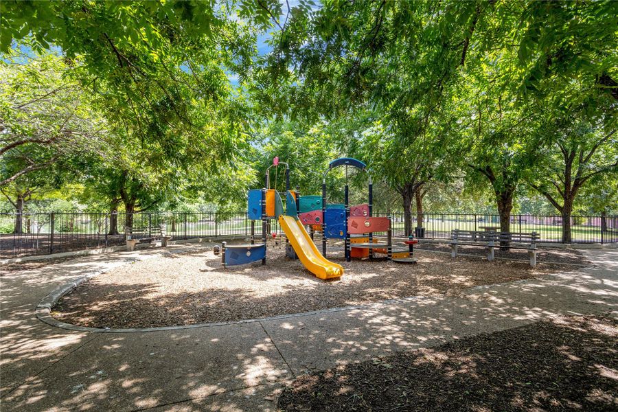 A well-shaded playground offers a vibrant activity structure for endless fun.