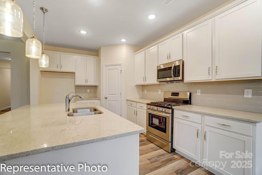 This home will have white cabinets and white marbled quartz