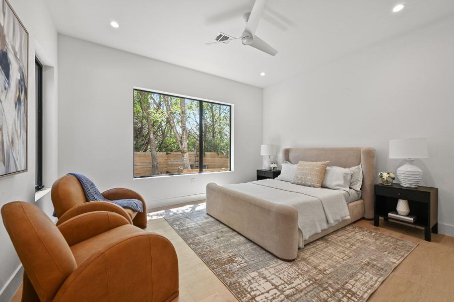 Bedroom featuring recessed lighting, a ceiling fan, and light wood finished floors