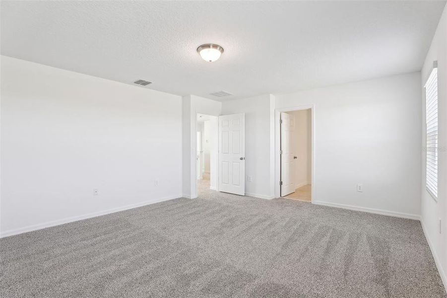 Spacious, unfurnished interior of a new home in Lake Deer Estates - Signature Series, Poinciana (Image 31). Spacious, unfurnished interior of a new home in Lake Deer Estates - Signature Series, Poinciana (Image 31).