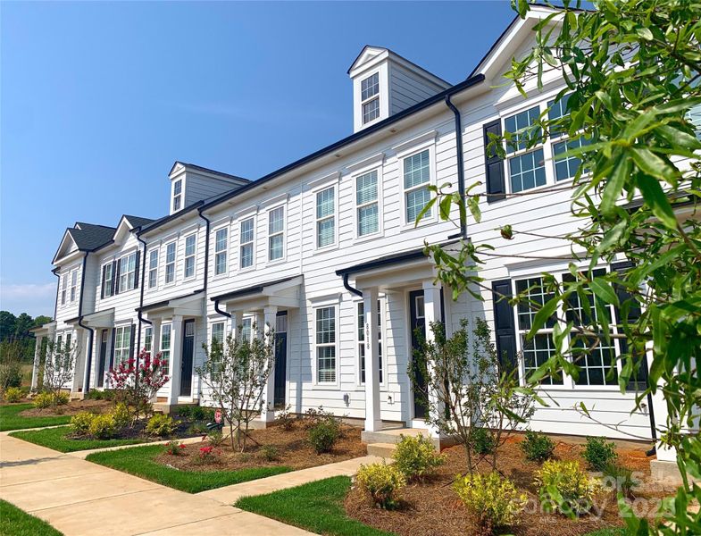 Front exterior of a new home in Edgewood Preserve, Huntersville, NC, highlighting curb appeal (Image 19). Front exterior of a new home in Edgewood Preserve, Huntersville, NC, highlighting curb appeal (Image 19).
