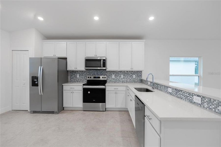 Furnished interior view inside a new home in , Port Charlotte (Image 3). Furnished interior view inside a new home in , Port Charlotte (Image 3).