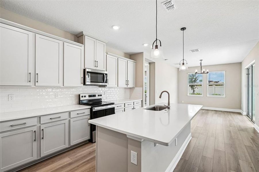 Furnished interior view inside a new home in Legends Preserve - Signature Series, Daytona Beach (Image 11).
