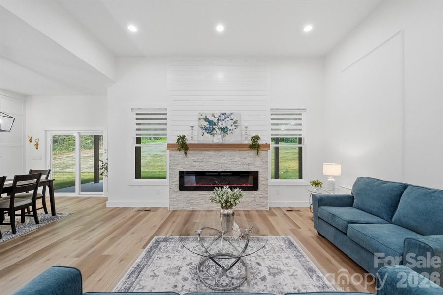 Tile electric fireplace, can lighting, views of the back yard...