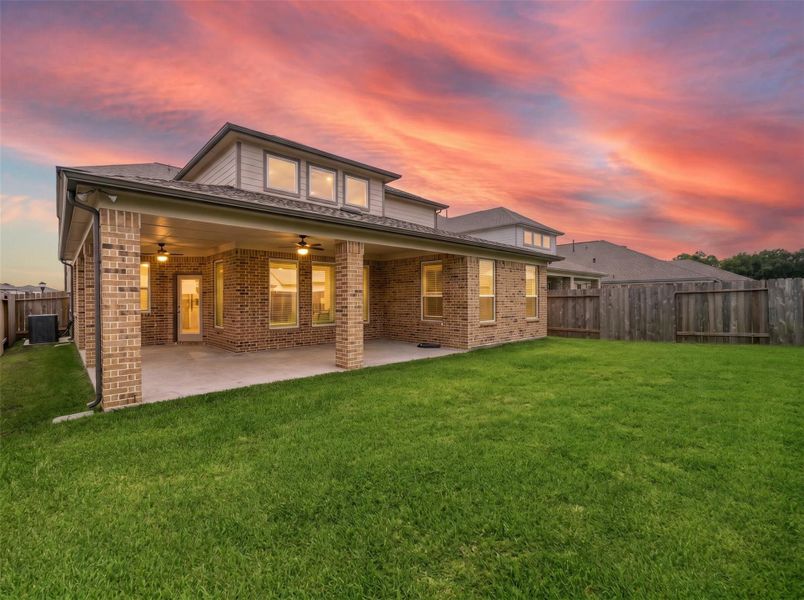 Enter your large covered patio that extends your living space outdoors, creating the perfect setting for relaxing evenings, weekend barbecues, and year-round entertaining.