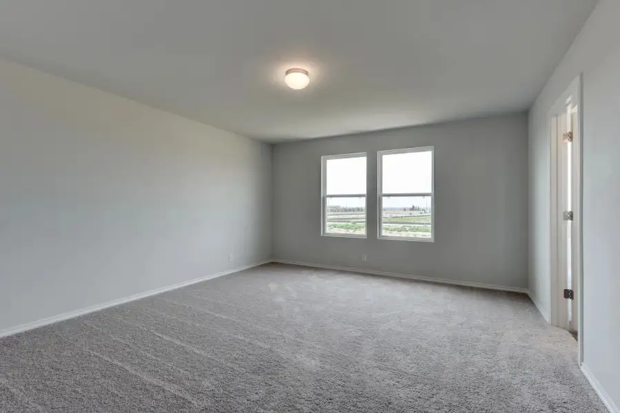 Representative unfurnished interior of a home built from the Colton by Ashton Woods in Saddlebrook Ranch, Schertz (Image 11).