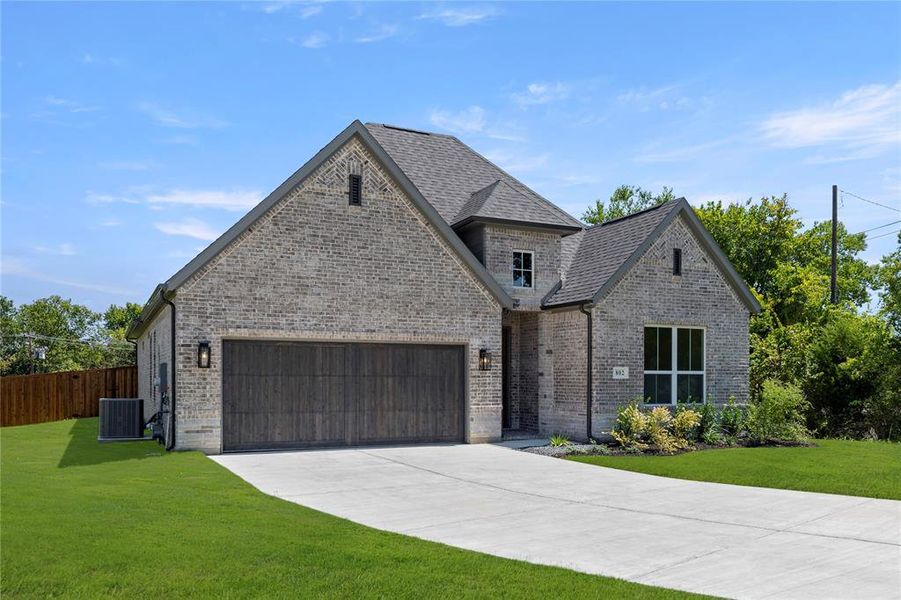 Front exterior of a new home in The Highlands, Rockwall, TX, highlighting curb appeal (Image 10).