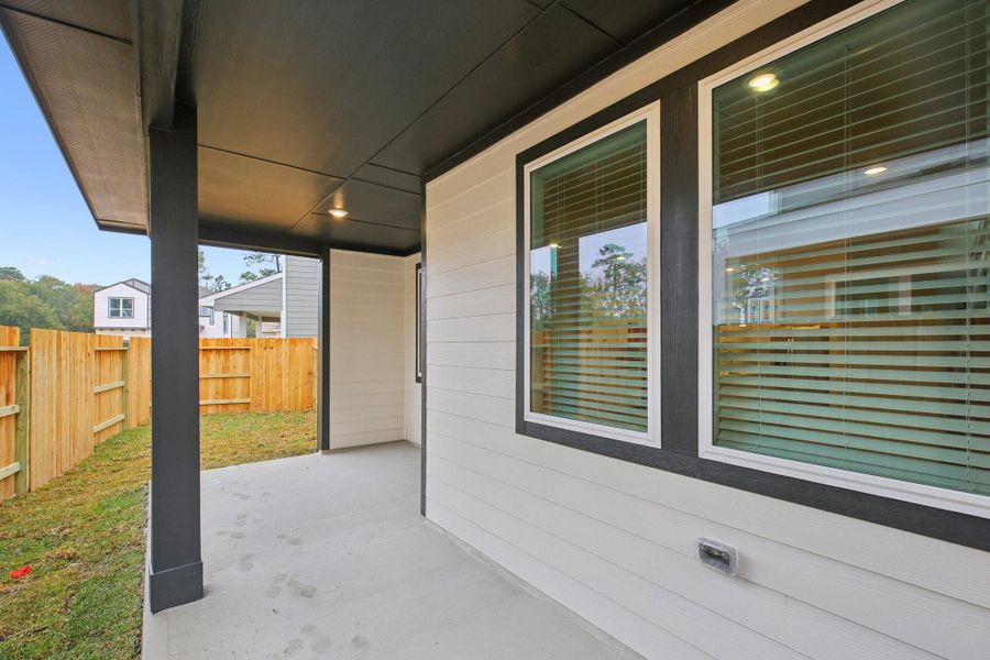 Exterior details and patio area of a home in Pinewood Trails - City Series, Atascocita (Image 26).