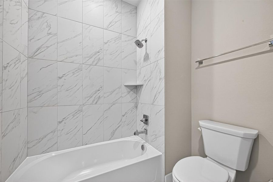 Secondary bathroom 2 upstairs with tub/shower combo shared between bedroom room 2 and 3.