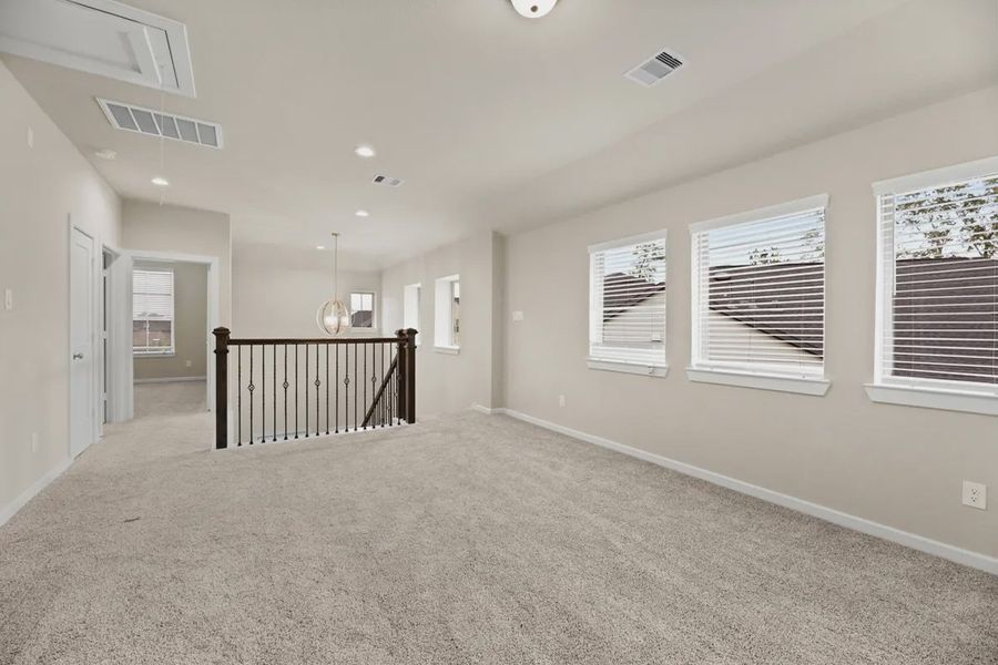 Representative unfurnished interior of a home built from the Sedona by Chesmar Homes in Sunterra, Katy (Image 8).