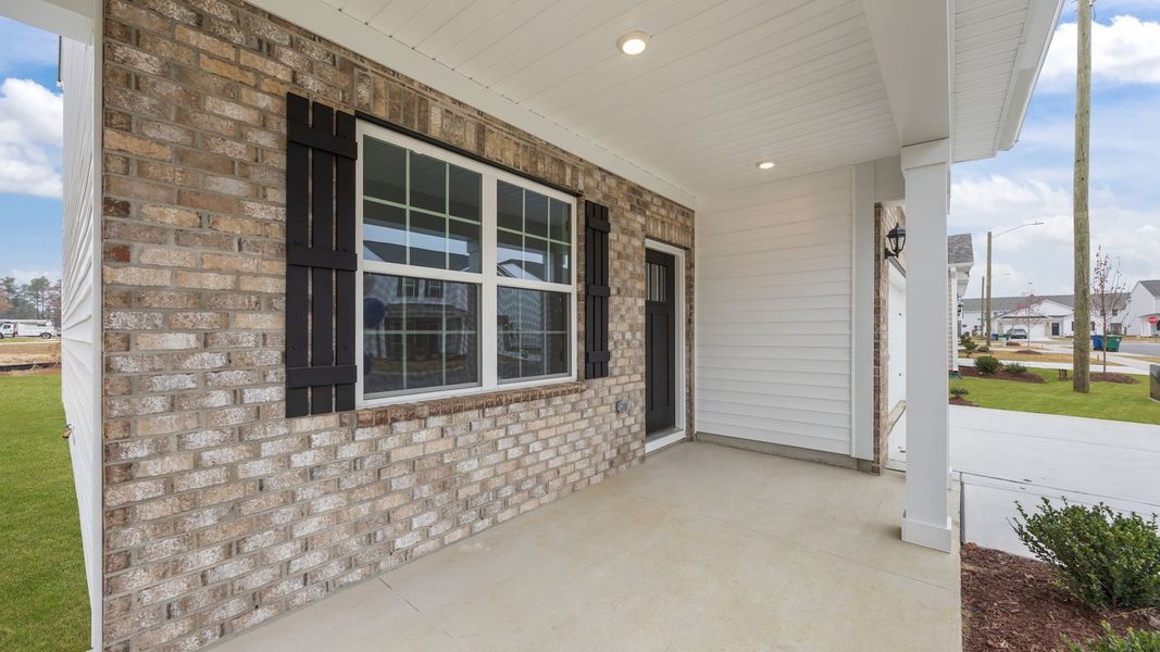 Exterior details and patio area of a home in Ridgewood Farms, Winterville (Image 4).