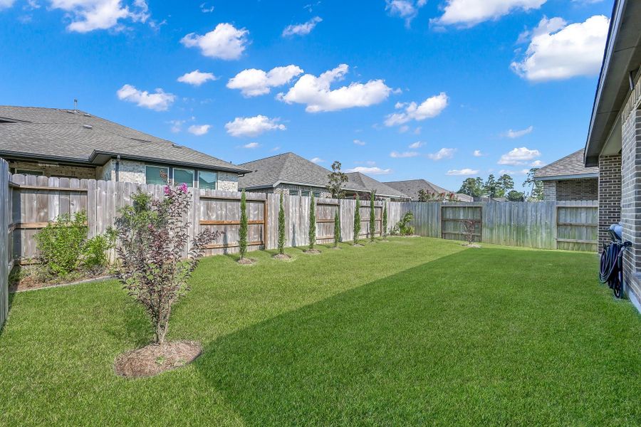 Front exterior of a new home in Grand Central Park 45', Conroe, TX, highlighting curb appeal (Image 20).