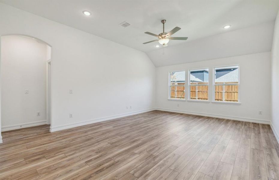 Spacious gathering room with large windows *real home pictured