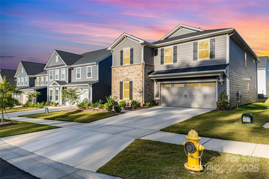 Front exterior of a new home in Cannon Run, Concord, NC, highlighting curb appeal (Image 2).