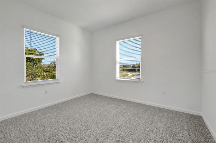 Spacious, unfurnished interior of a new home in Serenade at Ovation, Winter Garden (Image 29).